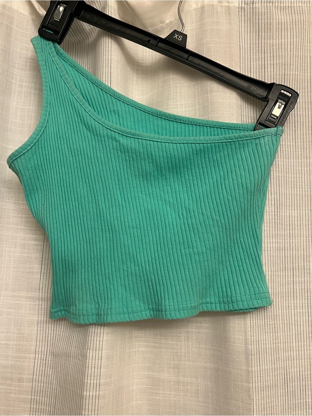 Beautiful mint green asymmetrical crop top with ribbed detailing!
